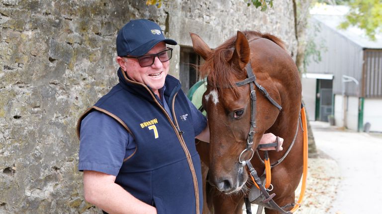 Trainer Jedd O'Keefe poses with Beep Beep Burrow at his base in Middleham